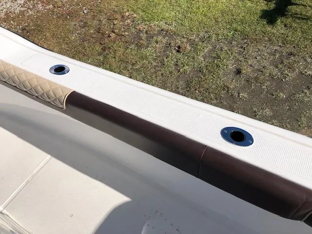 Slide: The Image of 2024 Reflex Gladiator boat interior with cushioned seating and rod holders. - 28