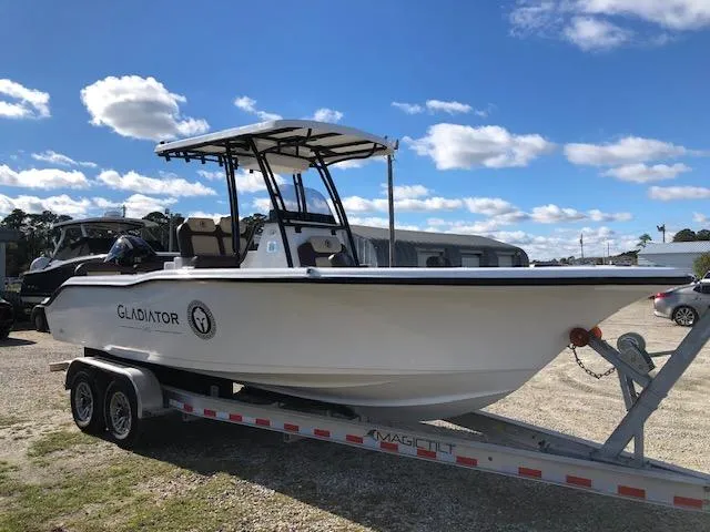 Slide: The Image of 2024 Reflex Gladiator boat on trailer under blue sky. - 3