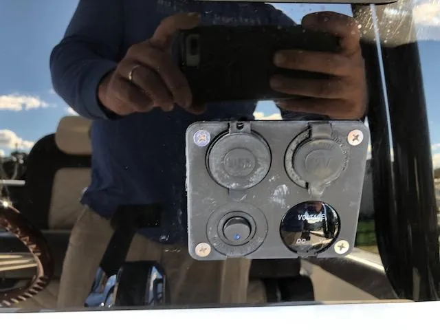 Slide: The Image of Close-up of a 2024 Reflex Gladiator control panel with dual sockets and a digital display. - 33