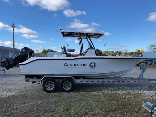 Slide: The Image of 2024 Reflex Gladiator boat on trailer under blue sky. - 4