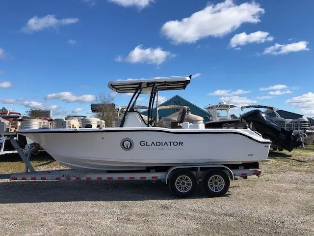 Slide: The Image of 2024 Reflex Gladiator boat on trailer under blue sky. - 8