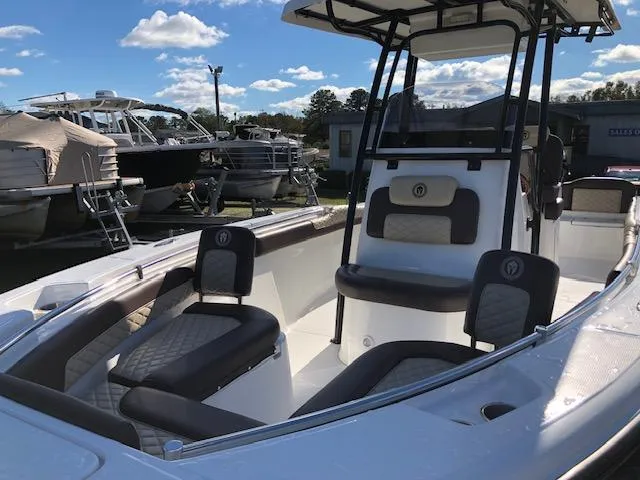 Slide: The Image of 2024 Reflex Gladiator boat interior with cushioned seating and sleek design. - 9