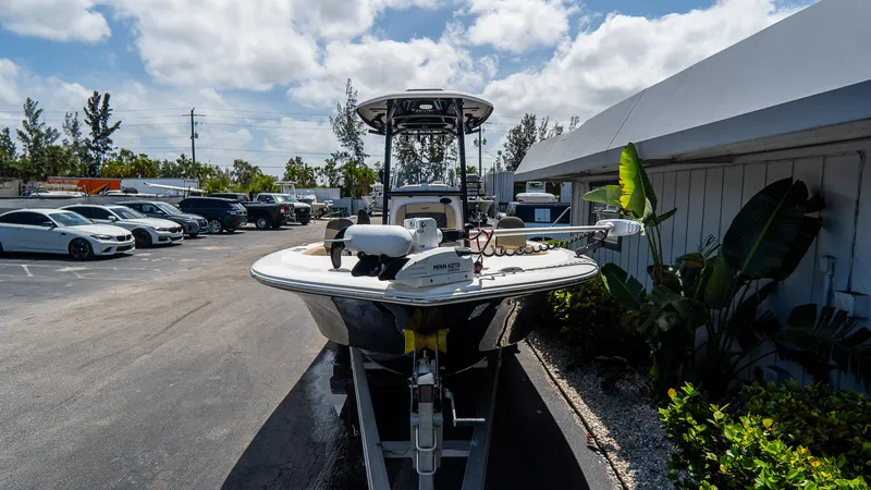 Slide: The Image of 2022 Tidewater 2300 Carolina Bay boat parked outdoors on a sunny day. - 2