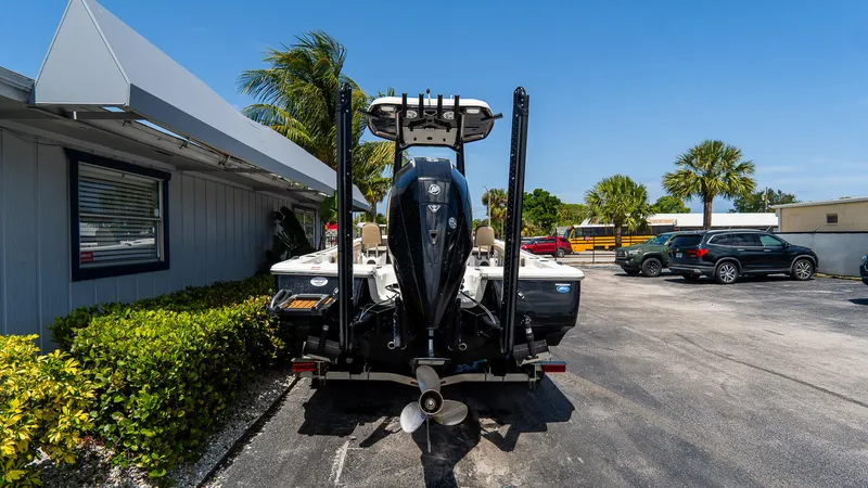 Slide: The Image of 2022 Tidewater 2300 Carolina Bay boat parked outdoors, rear view, sunny day. - 4