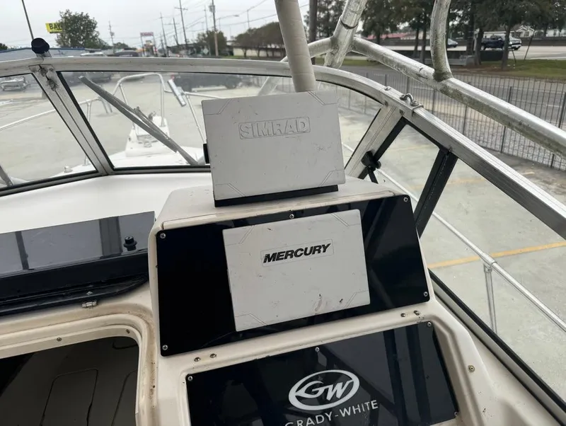 Slide: The Image of Grady-White 268 Islander WA 1995 boat dashboard with Mercury and Simrad equipment. - 11