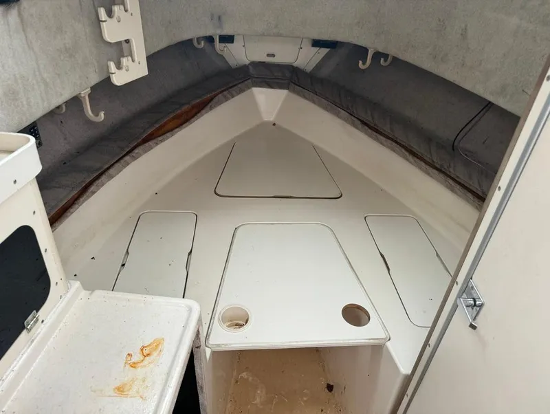 Slide: The Image of Interior cabin of 1995 Grady-White 268 Islander WA boat, featuring storage compartments. - 13