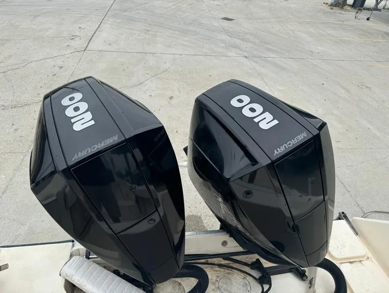 Slide: The Image of Twin Mercury outboard engines on a 1995 Grady-White 268 Islander WA boat. - 16