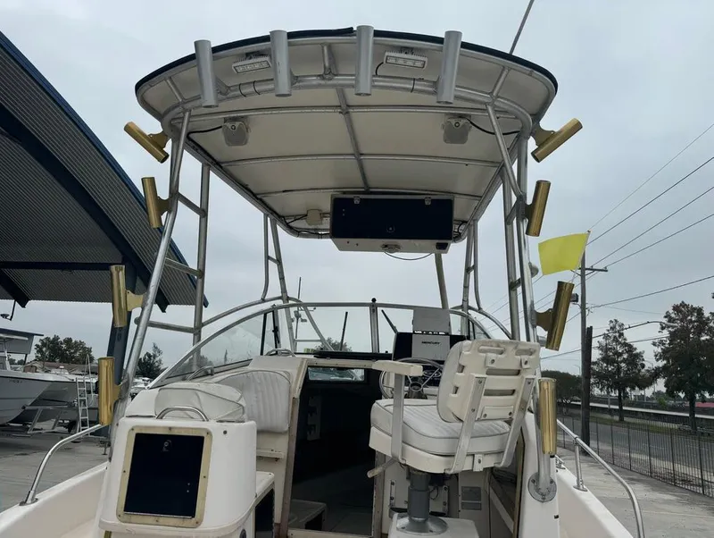 Slide: The Image of 1995 Grady-White 268 Islander WA boat with fishing rod holders and helm station. - 17