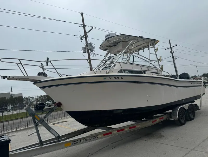 Slide: The Image of 1995 Grady-White 268 Islander WA boat on trailer, side view. - 2
