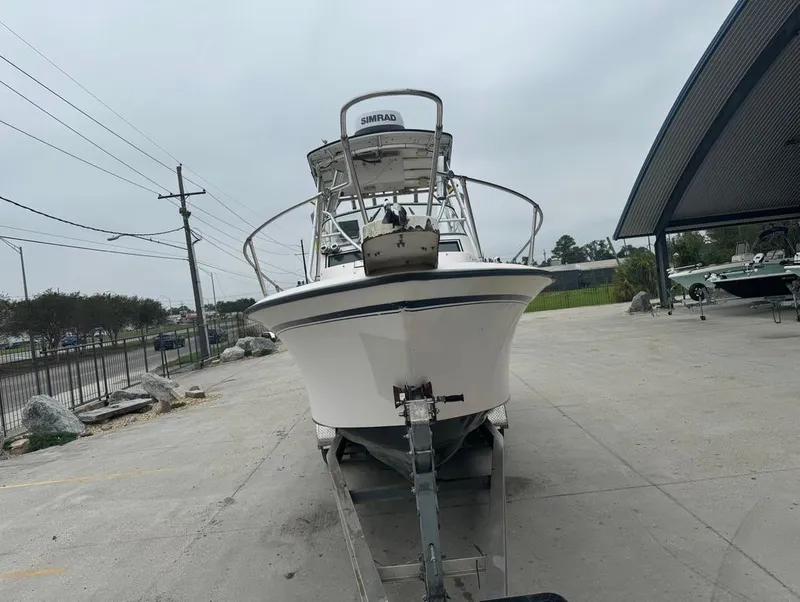 Slide: The Image of 1995 Grady-White 268 Islander WA boat on trailer in outdoor setting. - 3