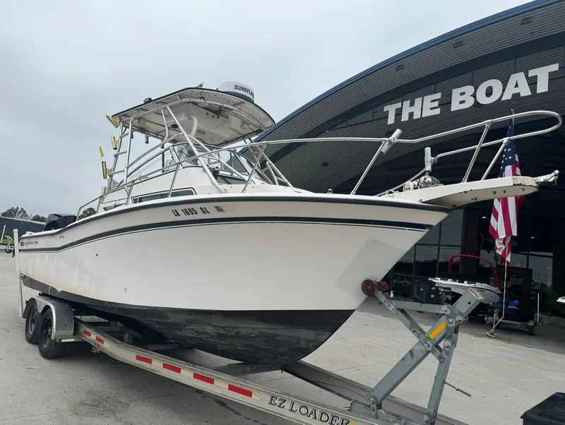 Slide: The Image of 1995 Grady-White 268 Islander WA boat on trailer outside dealership. - 4