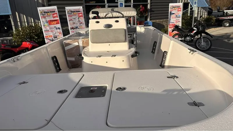 Slide: The Image of 2025 Carolina Skiff 178 JLS CC boat on display at outdoor showroom. - 3