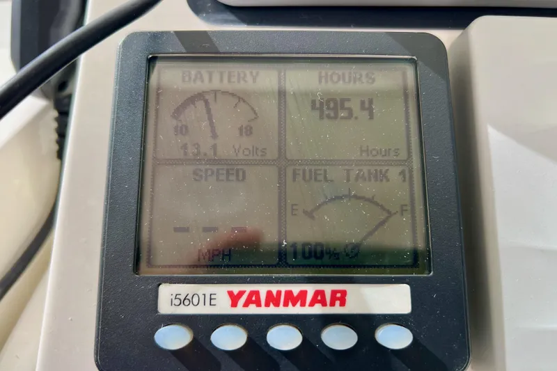 Slide: The Image of Yanmar i5601E display showing battery voltage, engine hours, speed, and fuel level on Marlow Pilot 31. - 18