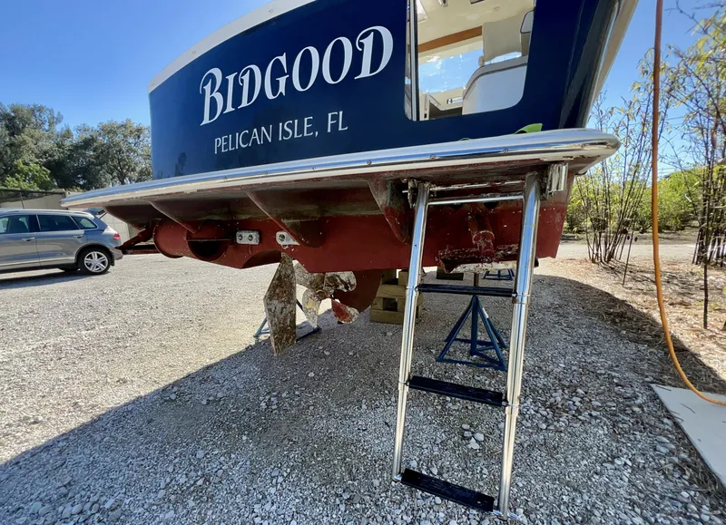 Slide: The Image of Marlow Pilot 31 boat, 2016 model, on land with ladder, Pelican Isle, FL. - 6