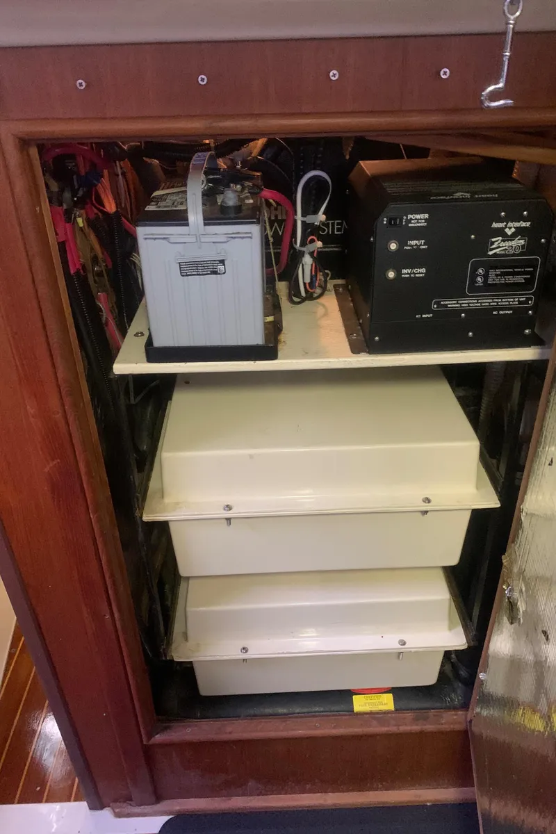 Slide: The Image of Electrical compartment of 1998 Hunter Passage 42 sailboat with battery and inverter. - 10