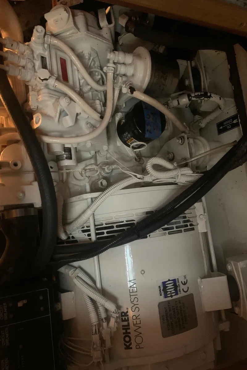 Slide: The Image of Engine compartment of 1998 Hunter Passage 42 with Kohler power system. - 12