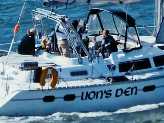 Slide: The Image of Sailing yacht Hunter Passage 42, 1998 model, cruising on open water. - 2