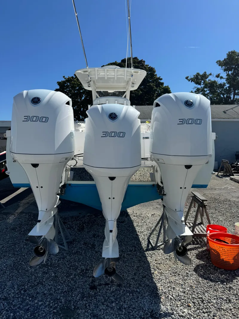 Slide: The Image of 2017 Buddy Davis 34 cc boat with triple 300 horsepower engines. - 13