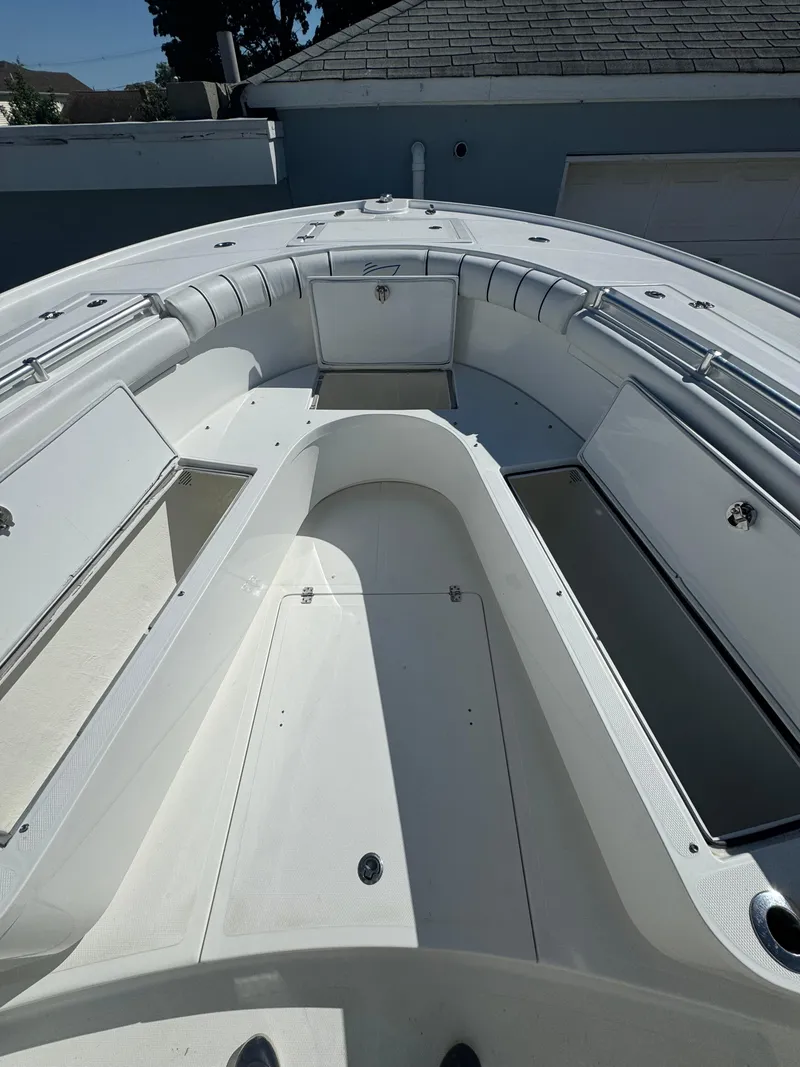 Slide: The Image of 2017 Buddy Davis 34 CC boat interior with open storage compartments. - 15
