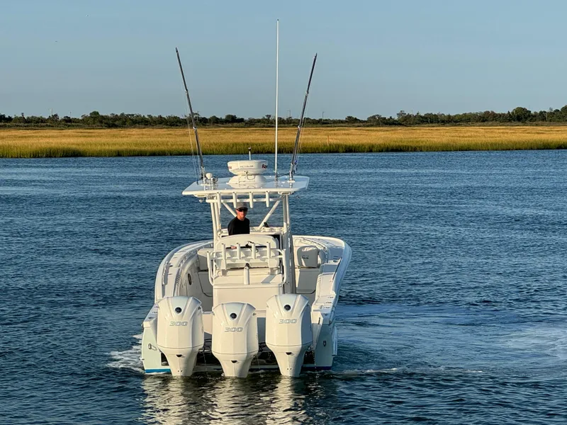 Slide: The Image of 2017 Buddy Davis 34 cc boat with triple engines on water. - 2