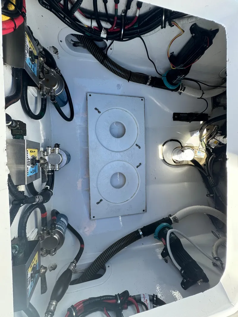 Slide: The Image of 2017 Buddy Davis 34 cc boat engine compartment with wiring and components. - 20
