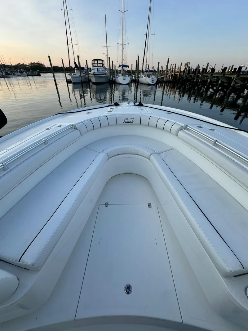 Slide: The Image of 2017 Buddy Davis 34 CC boat interior at marina during sunset. - 22