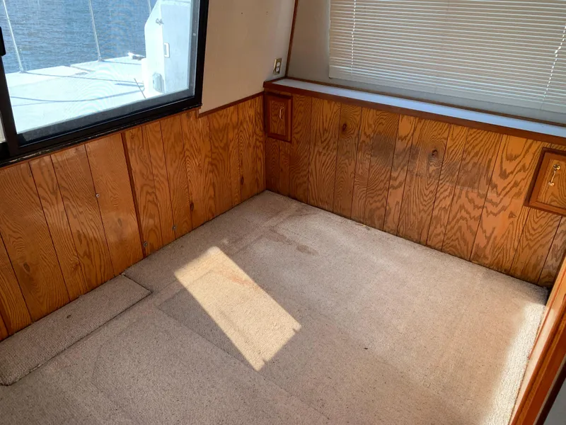 Slide: The Image of Interior of 1996 Harbor Master 460 WIDEBODY with wood paneling and carpet flooring. - 12