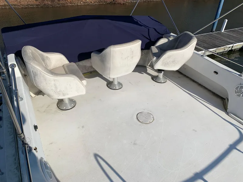Slide: The Image of 1996 Harbor Master 460 WIDEBODY boat deck with three swivel chairs. - 20