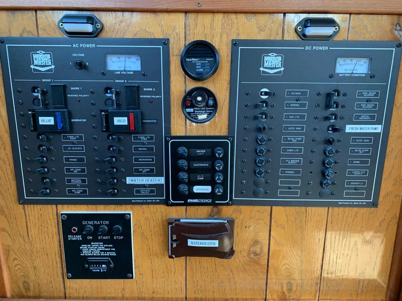 Slide: The Image of Control panel of a 1996 Harbor Master 460 WIDEBODY boat, featuring AC and DC power switches. - 5