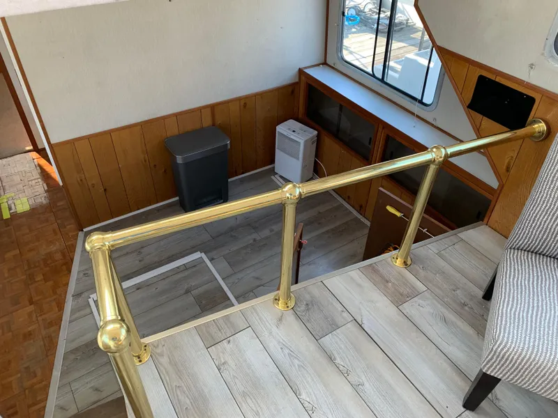 Slide: The Image of Interior of 1996 Harbor Master 460 WIDEBODY with brass railing and wood paneling. - 8
