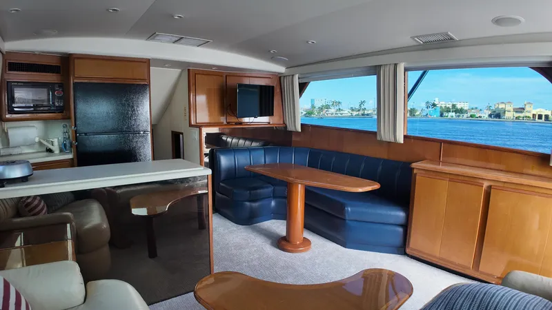 Slide: The Image of Interior of 1999 Viking 47 Convertible yacht with seating and ocean view. - 11