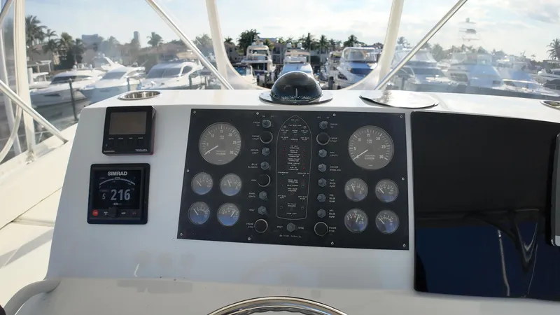 Slide: The Image of 1999 Viking 47 Convertible yacht dashboard with navigation instruments and gauges. - 33
