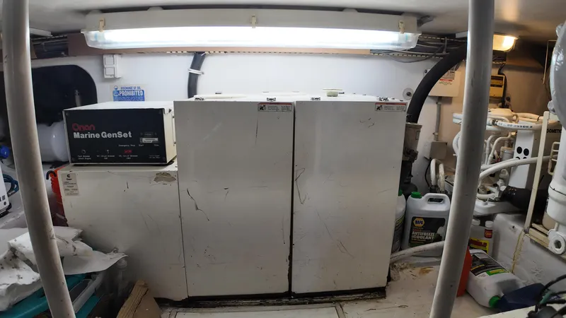 Slide: The Image of Engine room of 1999 Viking 47 Convertible with Marine GenSet generator. - 36