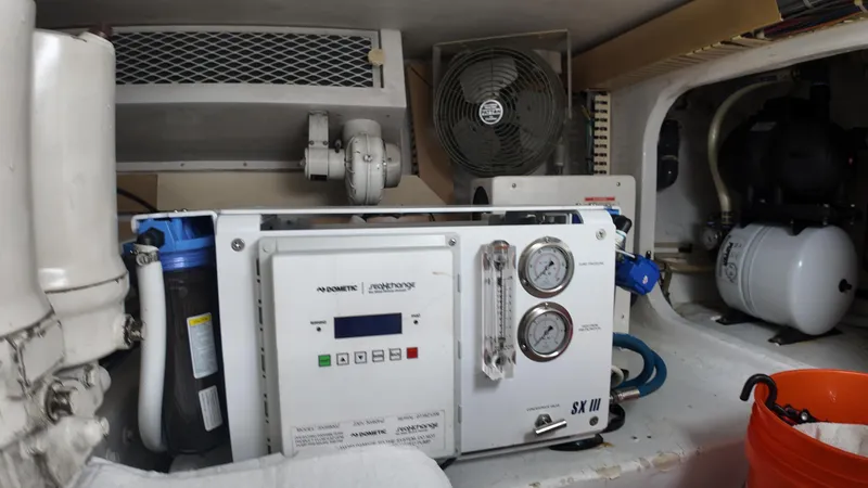 Slide: The Image of Engine room of 1999 Viking 47 Convertible with watermaker system and fan. - 37
