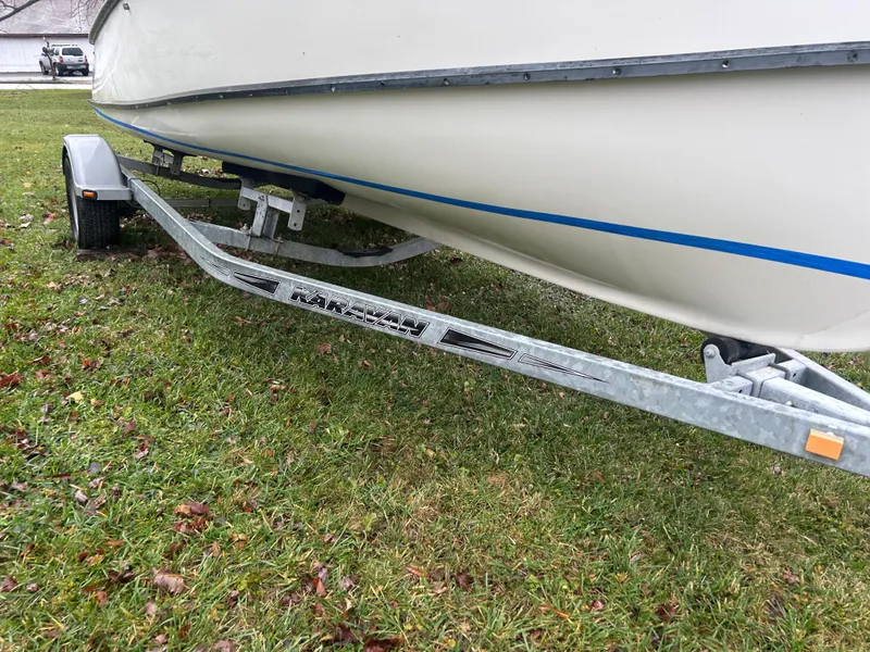 Slide: The Image of 2020 Flying Point Boatworks FP 21 on trailer, parked on grass. - 11