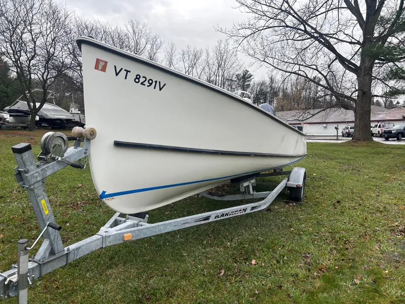 Slide: The Image of 2020 Flying Point Boatworks FP 21 on trailer, parked on grass. - 2