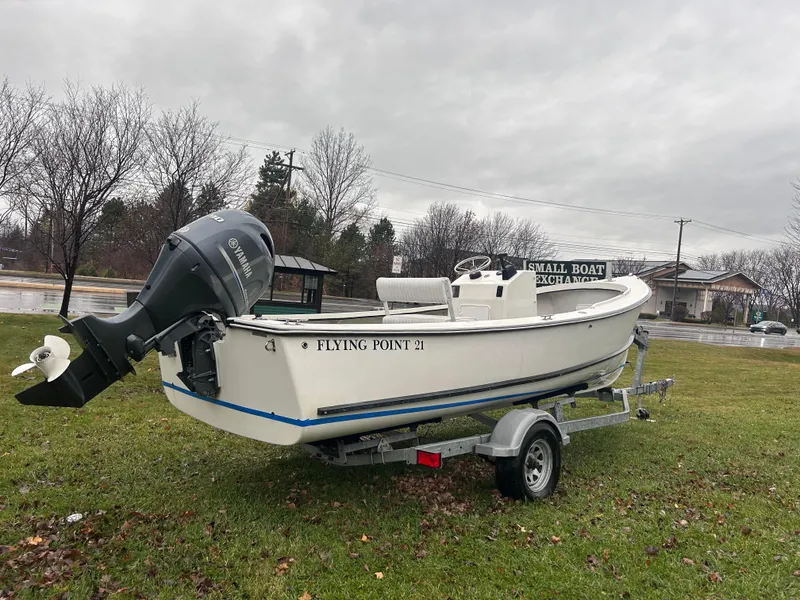 Slide: The Image of 2020 Flying Point Boatworks FP 21 on trailer, parked on grass, overcast sky. - 3
