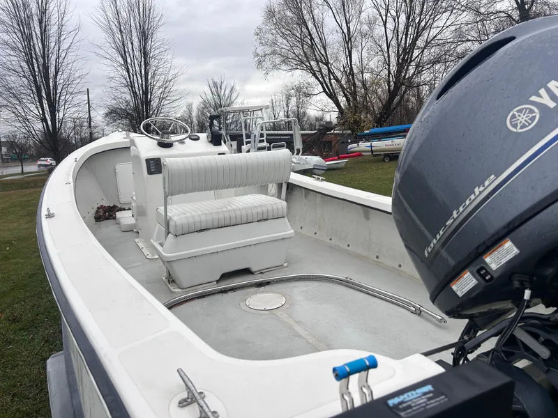 Slide: The Image of 2020 Flying Point Boatworks FP 21 with Yamaha engine, parked outdoors. - 9