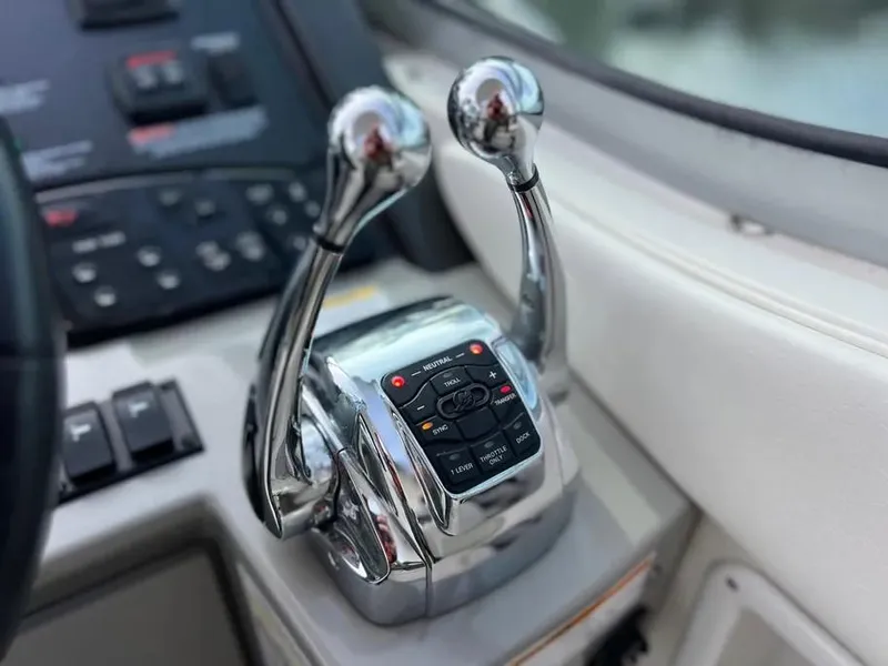 Slide: The Image of Close-up of 2015 Sea Ray 330 Sundancer throttle controls in cockpit. - 13