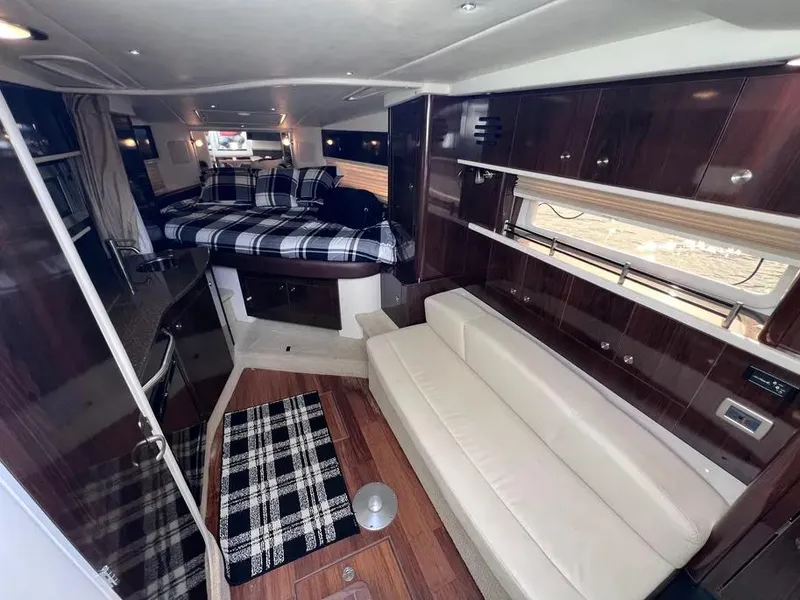Slide: The Image of Luxurious interior of 2015 Sea Ray 330 Sundancer yacht with modern furnishings. - 16