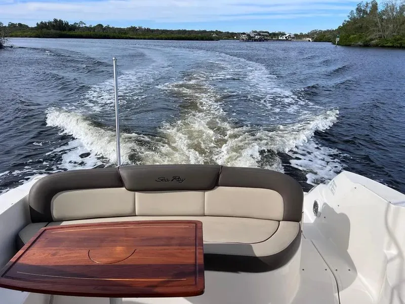 Slide: The Image of 2015 Sea Ray 330 Sundancer cruising on a scenic river. - 2