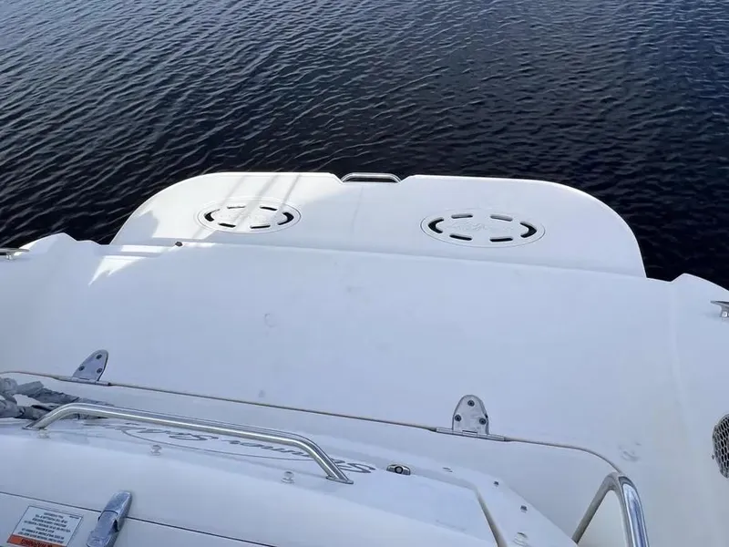 Slide: The Image of 2015 Sea Ray 330 Sundancer boat deck on calm water. - 5