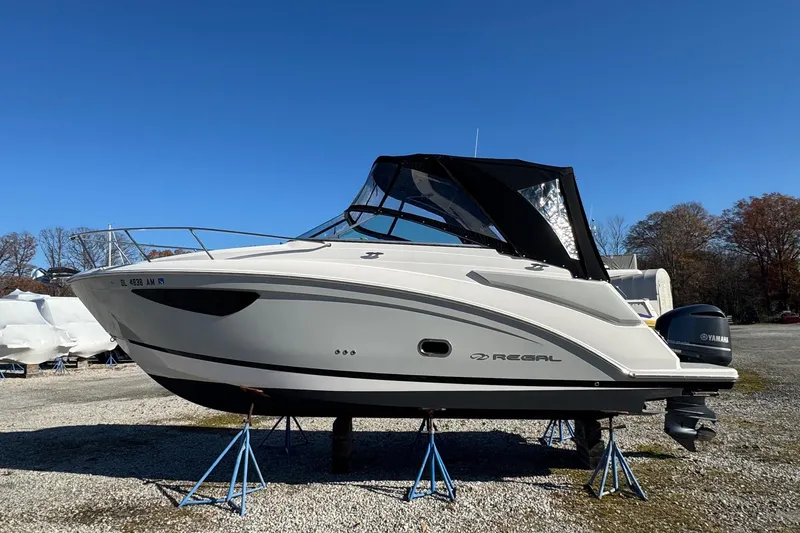 Slide: The Image of 2019 Regal 26 XO boat on stands, outdoor display. - 0