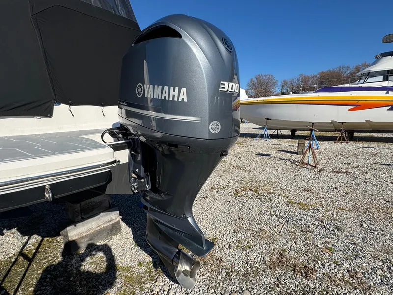 Slide: The Image of 2019 Regal 26 XO with Yamaha 300 outboard engine on gravel lot. - 11