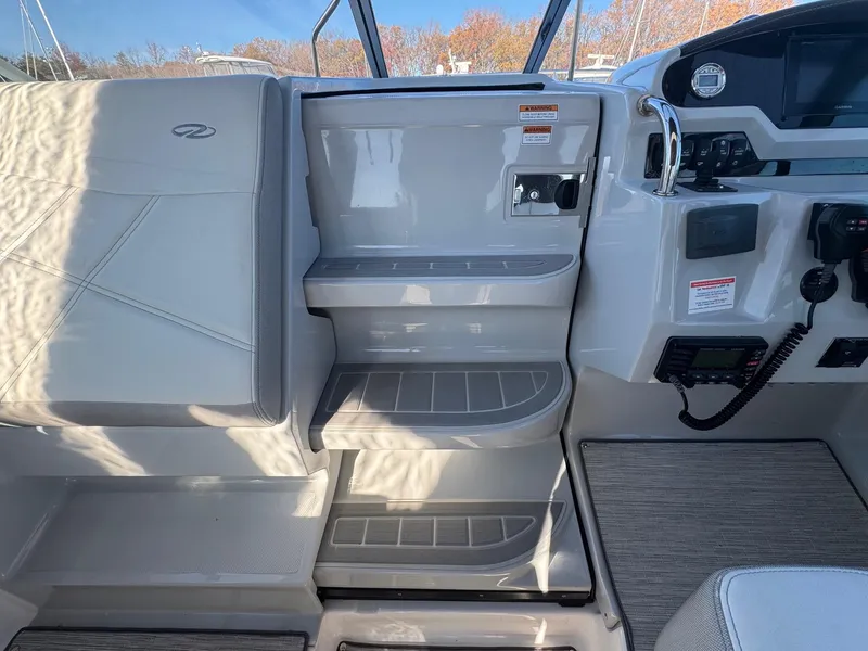Slide: The Image of Interior of 2019 Regal 26 XO boat showing helm and seating area. - 12