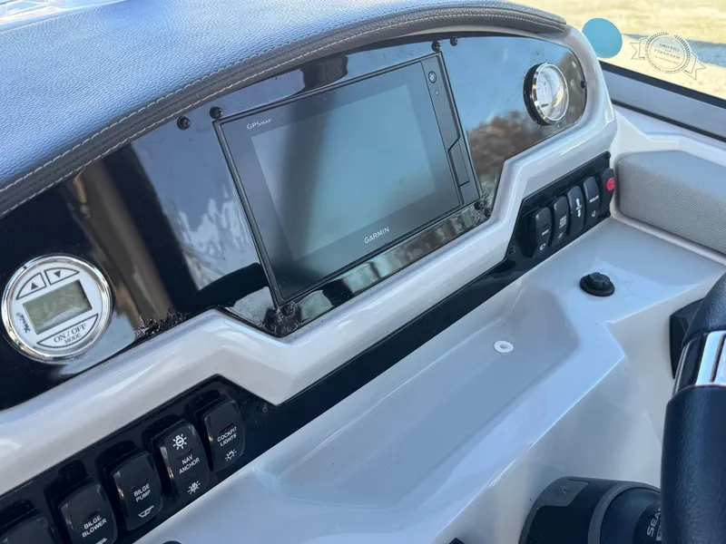 Slide: The Image of 2019 Regal 26 XO boat dashboard with Garmin navigation system. - 17