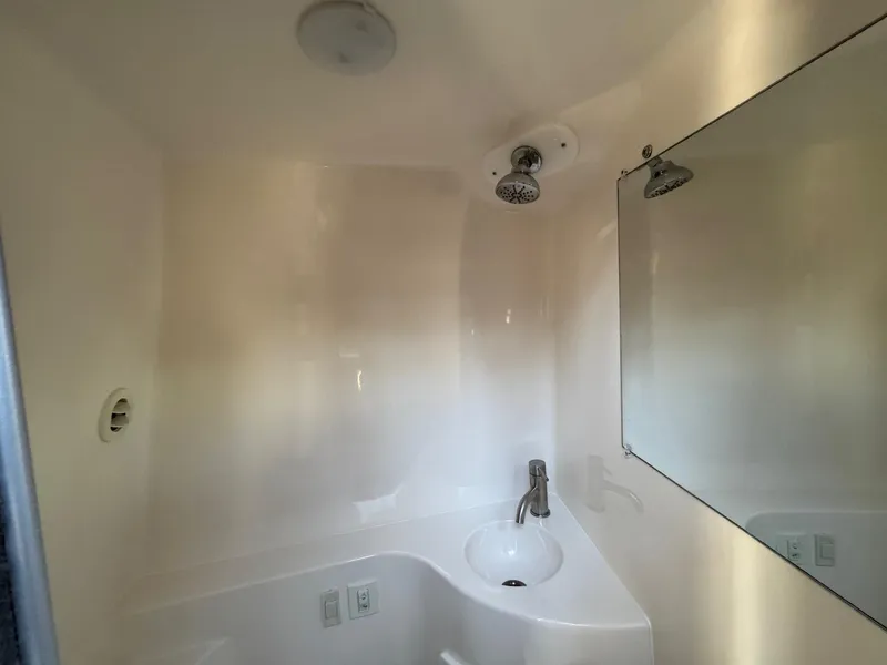 Slide: The Image of Compact bathroom in 2019 Regal 26 XO boat with shower and sink. - 37