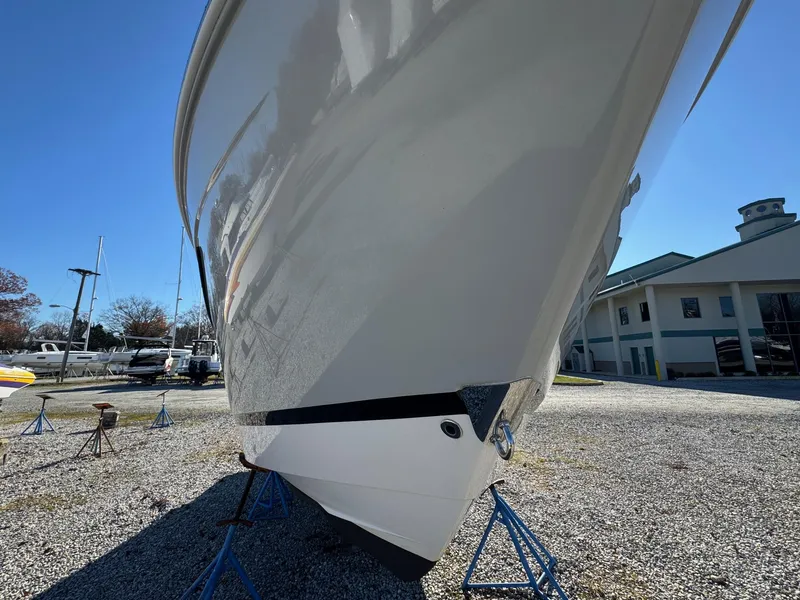 Slide: The Image of 2019 Regal 26 XO boat on stands in a marina setting. - 8
