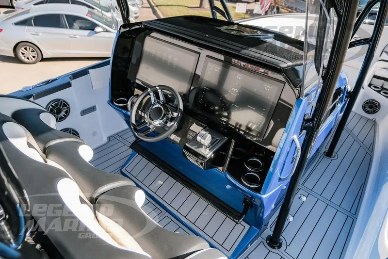 Slide: The Image of 2025 Nor-Tech 340 Sport boat cockpit with modern dashboard and steering wheel. - 10