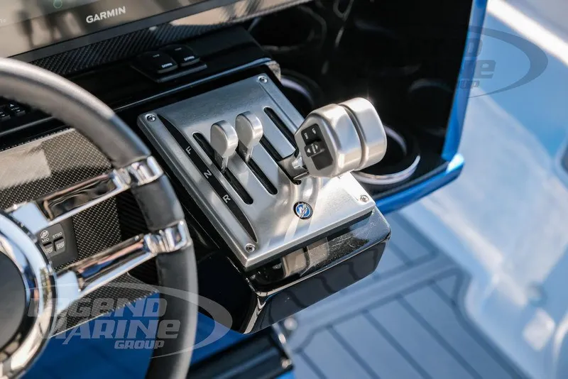 Slide: The Image of 2025 Nor-Tech 340 Sport control panel with steering wheel and throttle levers. - 13